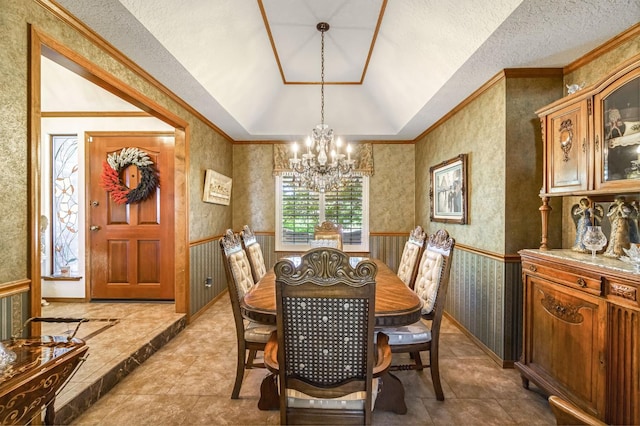 1721 W Wrenwood Ave, Fresno, CA 93711 - dining space with a chandelier, lofted ceiling, ornamental molding, wallpapered walls, and a wainscoted wall