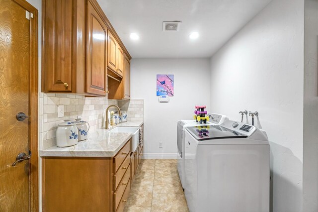 1721 W Wrenwood Ave, Fresno, CA 93711 - laundry room featuring washing machine and clothes dryer, light tile patterned floors, cabinet space, and recessed lighting