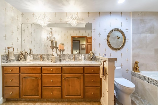 1721 W Wrenwood Ave, Fresno, CA 93711 - bathroom with a chandelier, wallpapered walls, a relaxing tiled tub, and double vanity