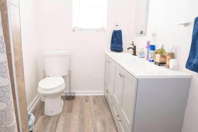 1413 W Fountain Way, Fresno, CA 93705 - bathroom with wood finished floors and vanity