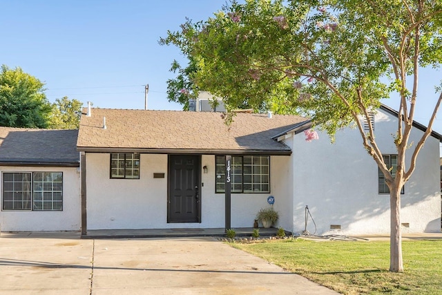 1413 W Fountain Way, Fresno, CA 93705 - view of front of house with a shingled roof, stucco siding, and a front lawn