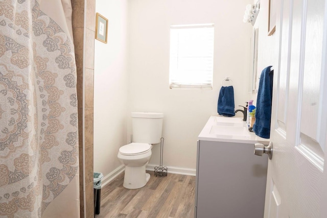 1413 W Fountain Way, Fresno, CA 93705 - bathroom with vanity, wood finished floors, and curtained shower