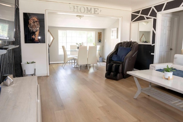 1413 W Fountain Way, Fresno, CA 93705 - living room with light wood-type flooring and plenty of natural light