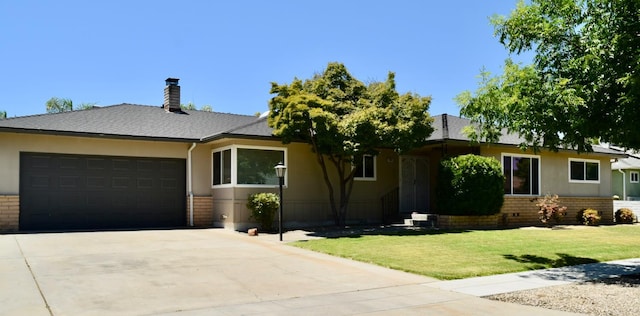 6061 N 9th St, Fresno, CA 93710 - ranch-style home with brick siding, a garage, driveway, and a front yard