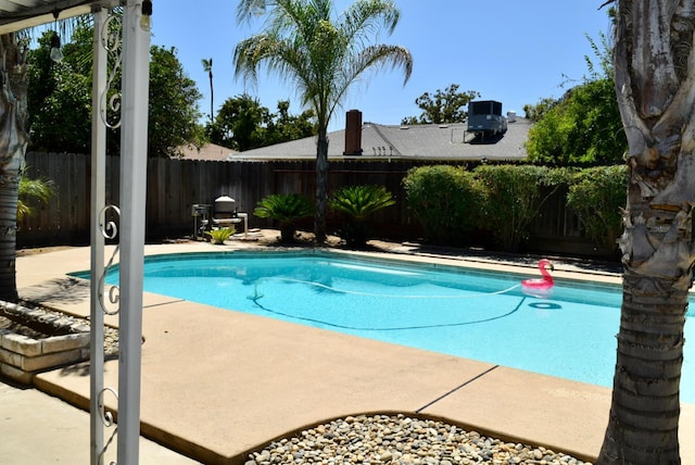 6061 N 9th St, Fresno, CA 93710 - view of swimming pool featuring a fenced backyard and a patio area