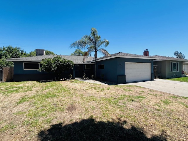 4308 N Cedar Ave, Fresno, CA 93726 - ranch-style house with a garage, driveway, stucco siding, and a front lawn