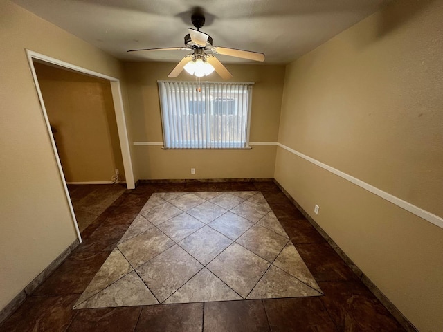 4308 N Cedar Ave, Fresno, CA 93726 - tiled spare room with a ceiling fan and baseboards