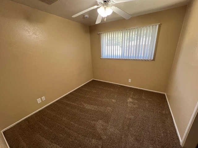 4308 N Cedar Ave, Fresno, CA 93726 - empty room with ceiling fan, dark colored carpet, and a smoke detector
