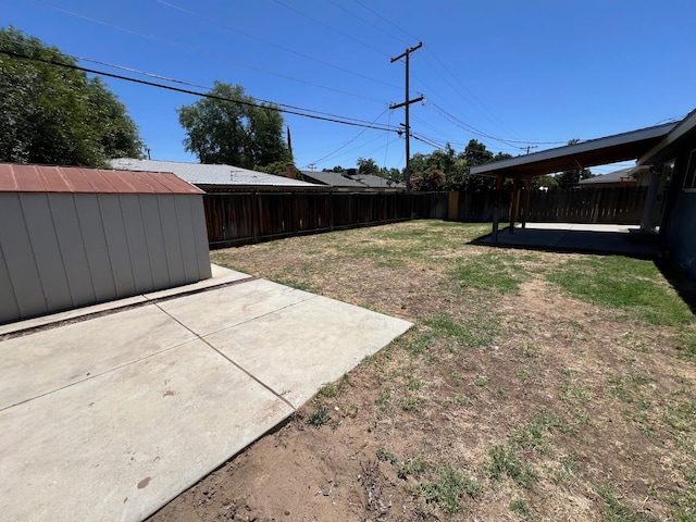 4308 N Cedar Ave, Fresno, CA 93726 - fenced backyard featuring a patio and a storage unit