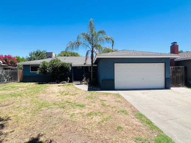 4308 N Cedar Ave, Fresno, CA 93726 - ranch-style home with a garage, concrete driveway, stucco siding, and a chimney