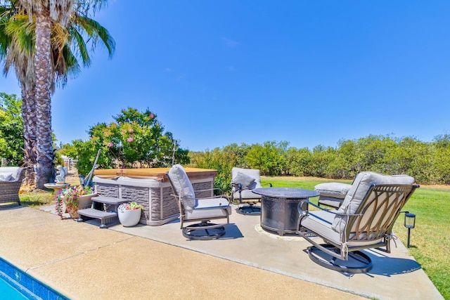 6589 N De Wolf Ave N, Clovis, CA 93619 - view of patio with an outdoor fire pit and a hot tub