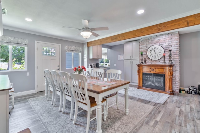 6589 N De Wolf Ave N, Clovis, CA 93619 - dining space featuring healthy amount of natural light, ceiling fan, a fireplace, light wood-type flooring, and recessed lighting