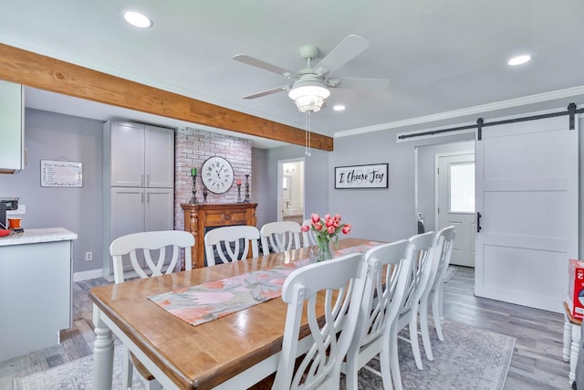 6589 N De Wolf Ave N, Clovis, CA 93619 - dining room featuring a barn door, a ceiling fan, light wood-style flooring, recessed lighting, and crown molding