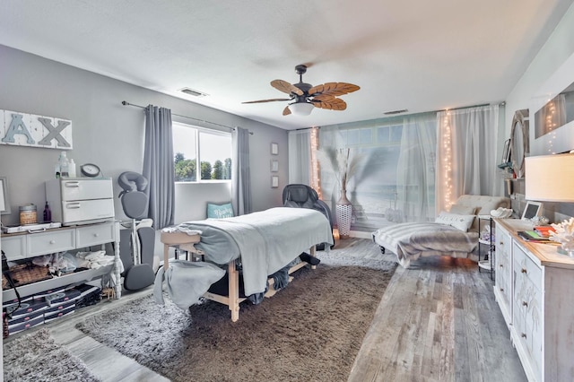 6589 N De Wolf Ave N, Clovis, CA 93619 - bedroom featuring wood finished floors and ceiling fan