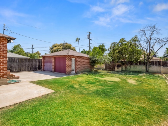 2845 N Adoline Ave, Fresno, CA 93705 - fenced backyard featuring an outdoor structure, a garage, and a patio area