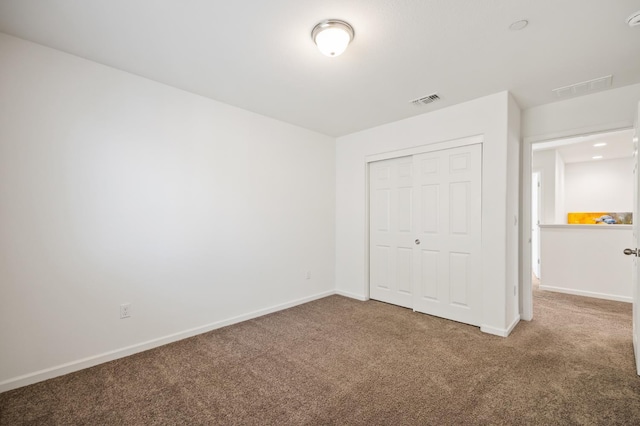 7141 N Shiraz Ave, Fresno, CA 93722 - unfurnished bedroom featuring carpet floors and a closet