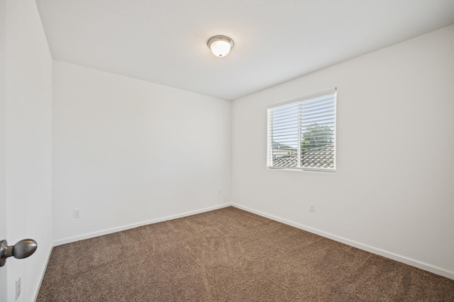7141 N Shiraz Ave, Fresno, CA 93722 - carpeted spare room featuring baseboards