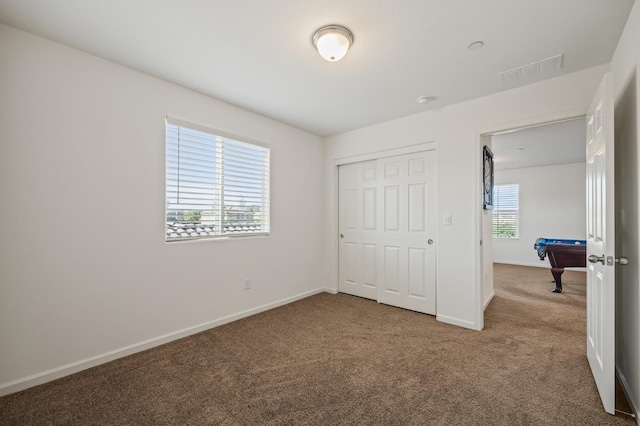 7141 N Shiraz Ave, Fresno, CA 93722 - unfurnished bedroom featuring carpet, a closet, and pool table