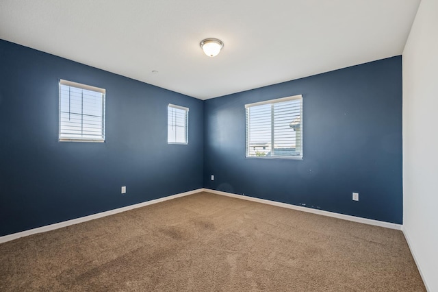 7141 N Shiraz Ave, Fresno, CA 93722 - carpeted empty room featuring baseboards