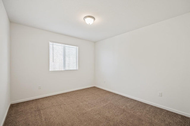7141 N Shiraz Ave, Fresno, CA 93722 - spare room with carpet and baseboards