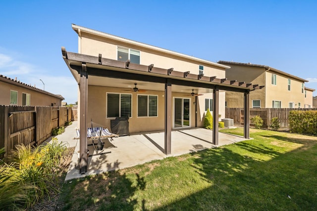 7141 N Shiraz Ave, Fresno, CA 93722 - back of property with stucco siding, a ceiling fan, a fenced backyard, and a patio area