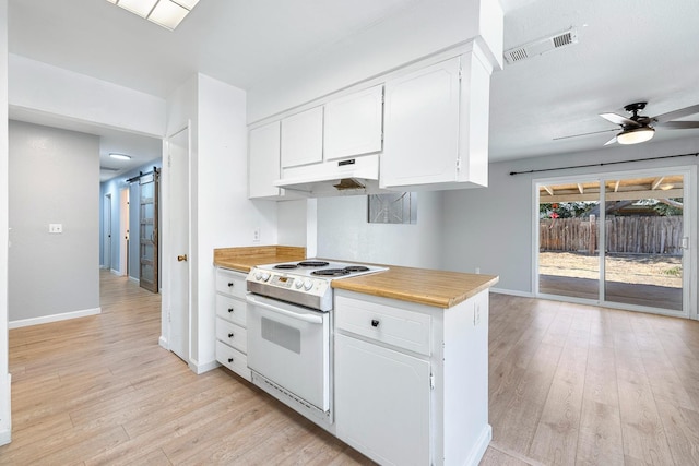 3318 Stanford Ave, Clovis, CA 93611 - kitchen with electric range, light wood-type flooring, white cabinetry, and a barn door