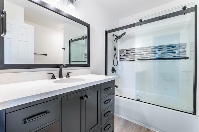 3318 Stanford Ave, Clovis, CA 93611 - full bathroom with vanity, bath / shower combo with glass door, and wood finished floors