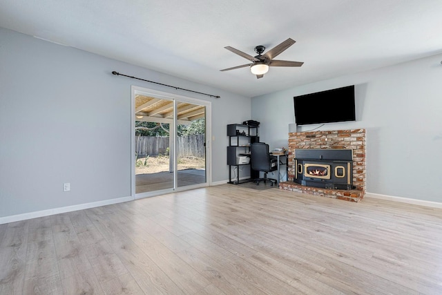 3318 Stanford Ave, Clovis, CA 93611 - living area with wood finished floors, ceiling fan, and a brick fireplace