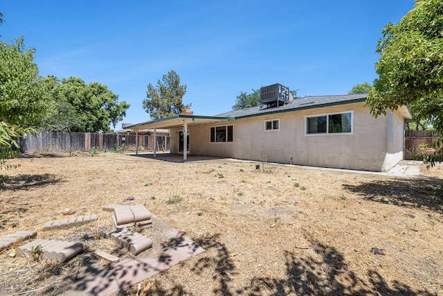 3318 Stanford Ave, Clovis, CA 93611 - back of property with a fenced backyard, a patio, and stucco siding