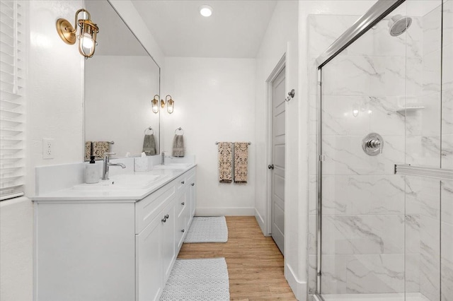 859 Windmill Ave, Clovis, CA 93619 - full bathroom with vanity, a shower stall, wood finished floors, and recessed lighting