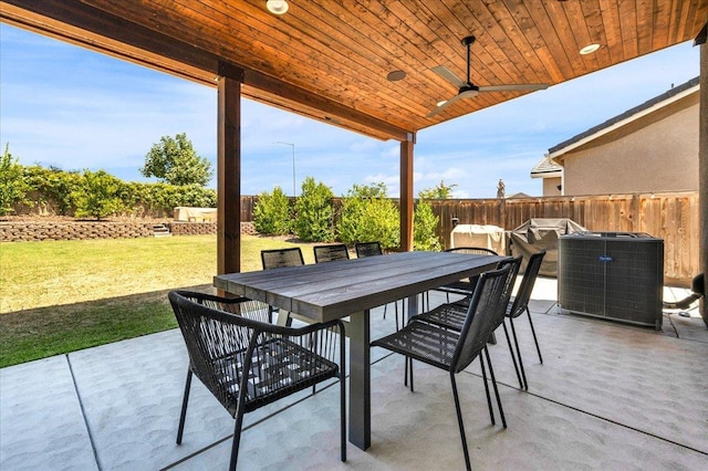 859 Windmill Ave, Clovis, CA 93619 - fenced backyard featuring outdoor dining area, a patio, and a ceiling fan