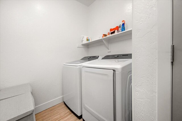 859 Windmill Ave, Clovis, CA 93619 - laundry room with independent washer and dryer, light wood finished floors, and a textured wall
