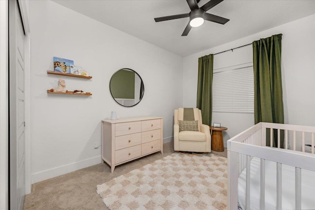 859 Windmill Ave, Clovis, CA 93619 - bedroom featuring a crib, light colored carpet, and ceiling fan