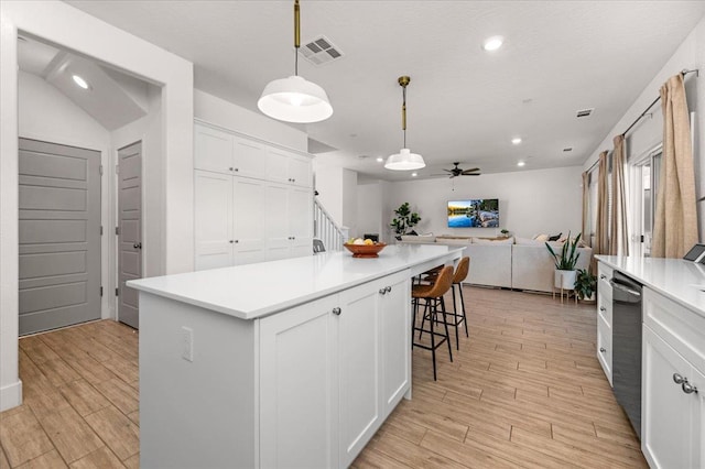 859 Windmill Ave, Clovis, CA 93619 - kitchen with open floor plan, a ceiling fan, white cabinets, light wood finished floors, and recessed lighting