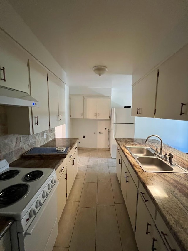 1205 F St, Reedley, CA 93654 - kitchen with white appliances, light tile patterned floors, white cabinetry, decorative backsplash, and under cabinet range hood
