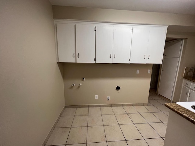1205 F St, Reedley, CA 93654 - laundry area with cabinet space, light tile patterned floors, and gas dryer hookup