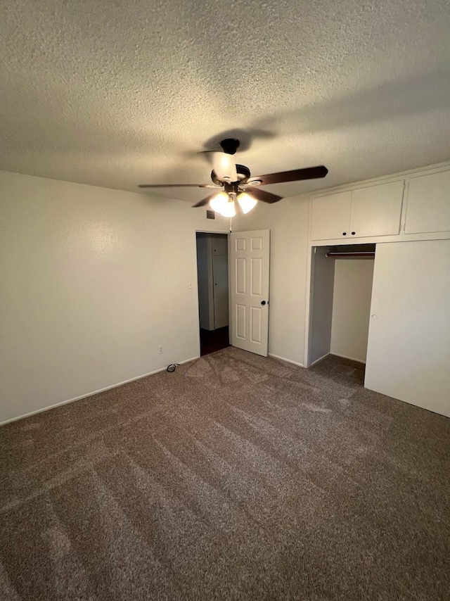 1205 F St, Reedley, CA 93654 - unfurnished bedroom with dark colored carpet, a textured ceiling, a ceiling fan, and a closet