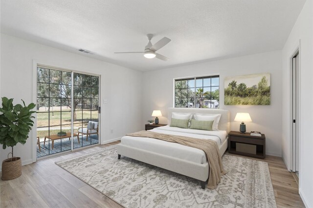 19730 Brightwood Rd, Madera, CA 93638 - bedroom with access to outside, wood finished floors, and ceiling fan
