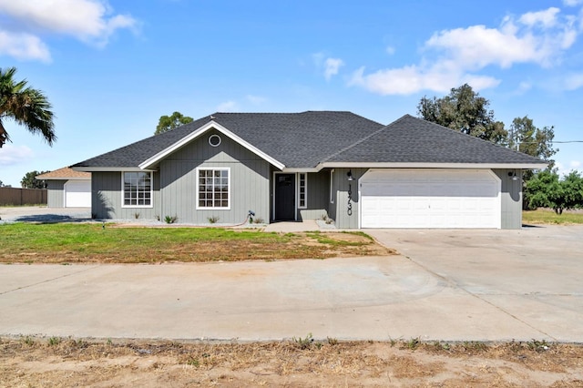 19730 Brightwood Rd, Madera, CA 93638 - ranch-style house featuring an attached garage, driveway, and roof with shingles