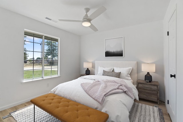 19730 Brightwood Rd, Madera, CA 93638 - bedroom featuring light wood-type flooring, multiple windows, and ceiling fan