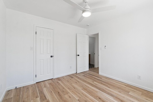 19730 Brightwood Rd, Madera, CA 93638 - unfurnished bedroom with light wood-style flooring and ceiling fan