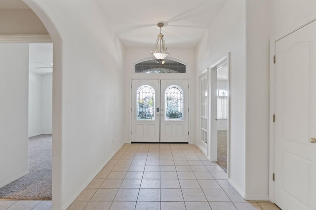 122 E Loop, Madera, CA 93637 - foyer entrance featuring plenty of natural light, arched walkways, and light tile patterned floors