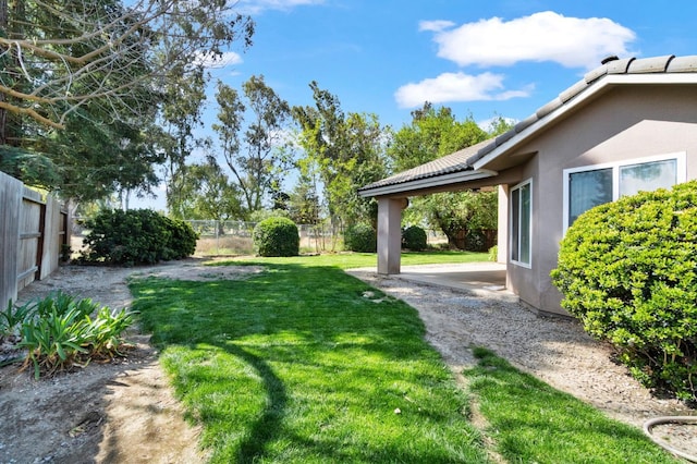 122 E Loop, Madera, CA 93637 - fenced backyard featuring a patio