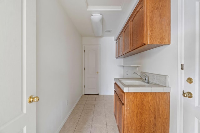 122 E Loop, Madera, CA 93637 - laundry area with a sink and light tile patterned floors
