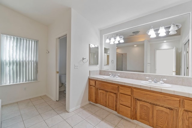 122 E Loop, Madera, CA 93637 - bathroom with double vanity and tile patterned floors
