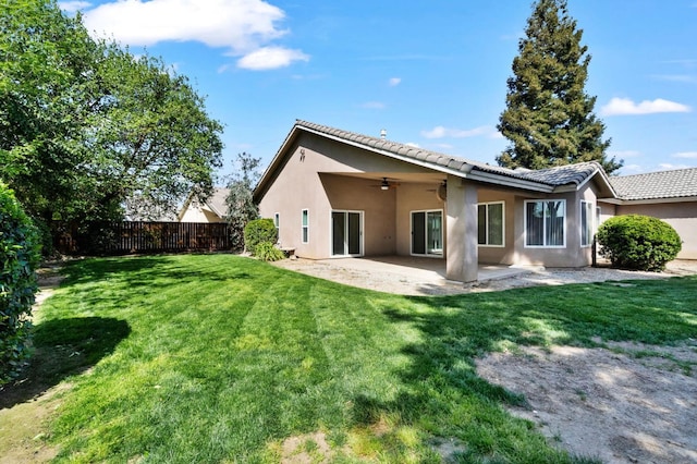 122 E Loop, Madera, CA 93637 - back of house featuring ceiling fan, stucco siding, a patio, and a tile roof