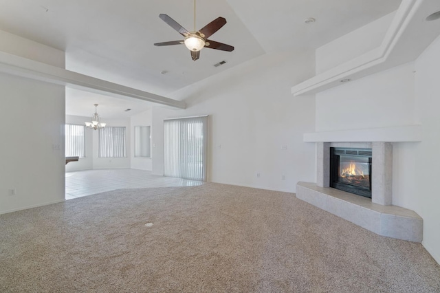 122 E Loop, Madera, CA 93637 - unfurnished living room with carpet, a fireplace, a chandelier, ceiling fan, and lofted ceiling