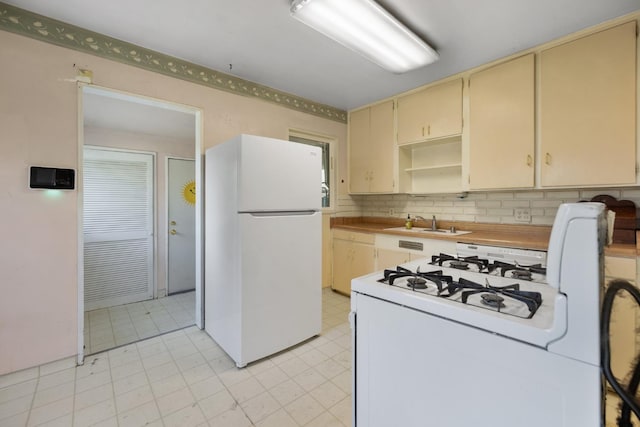 513 W Fountain Way, Fresno, CA 93705 - kitchen featuring white appliances, cream cabinets, light flooring, decorative backsplash, and open shelves