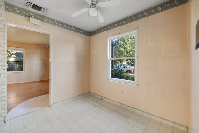 513 W Fountain Way, Fresno, CA 93705 - unfurnished room featuring a ceiling fan and light tile patterned floors