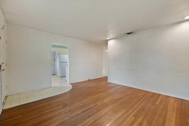 513 W Fountain Way, Fresno, CA 93705 - unfurnished room with light wood-style floors and recessed lighting